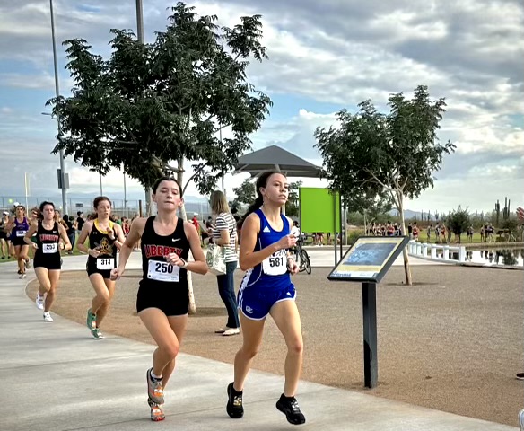 Nya Richardson, sophomore, sprints for the finish line at cross country race. 