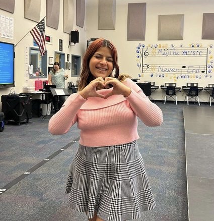 Rowan Balma, sophomore, showcases positivity in the choir room.