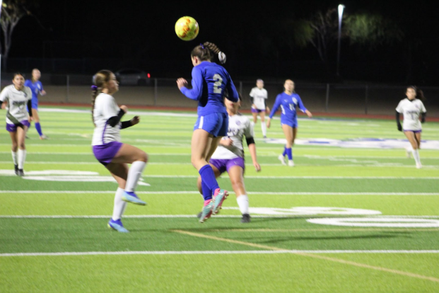 Cara Davidson, junior, clears the ball from the opponent.