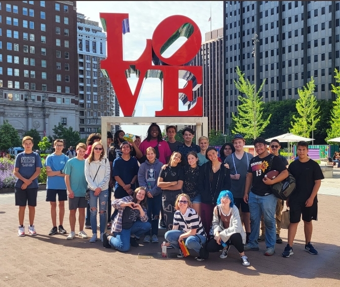 The Academy stands in front of the LOVE sign in Philadelphia, PA, on their summer 2022 trip.