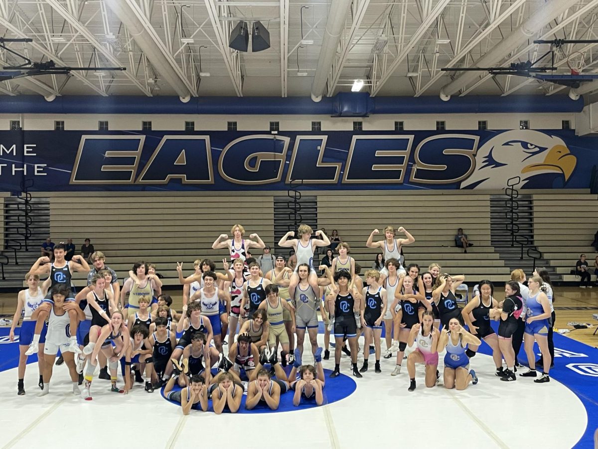 Girls and Boys wrestling team pose for a photo