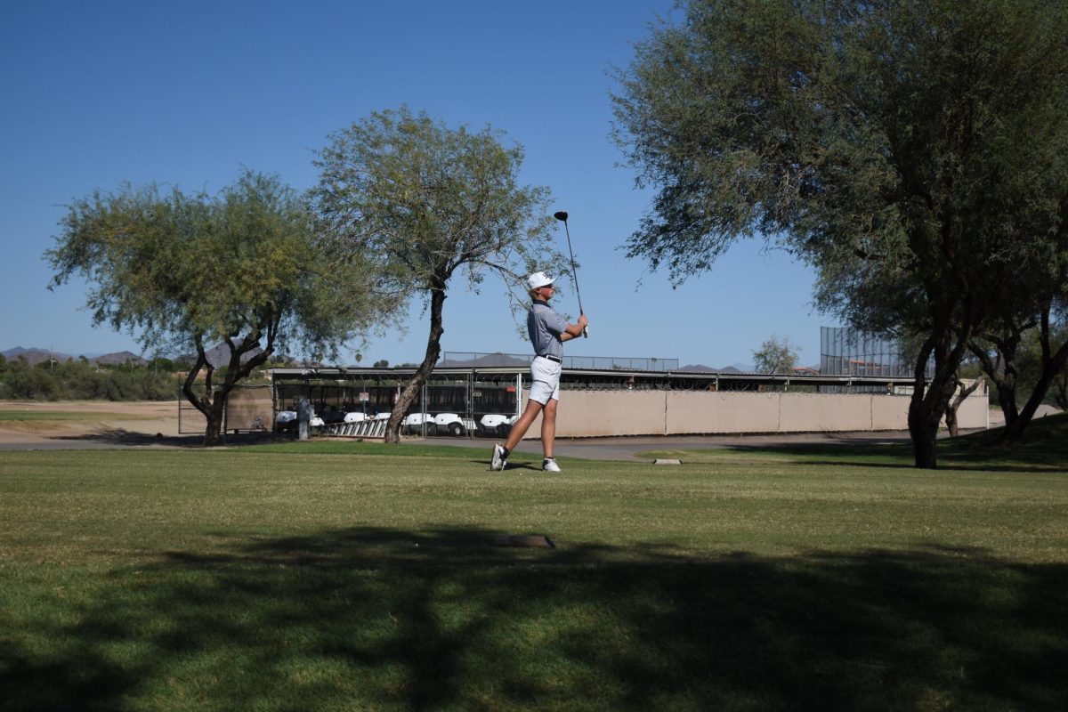 Ian Sager, junior, takes his first swing on hole one at boys golf's home game at the 500 club.