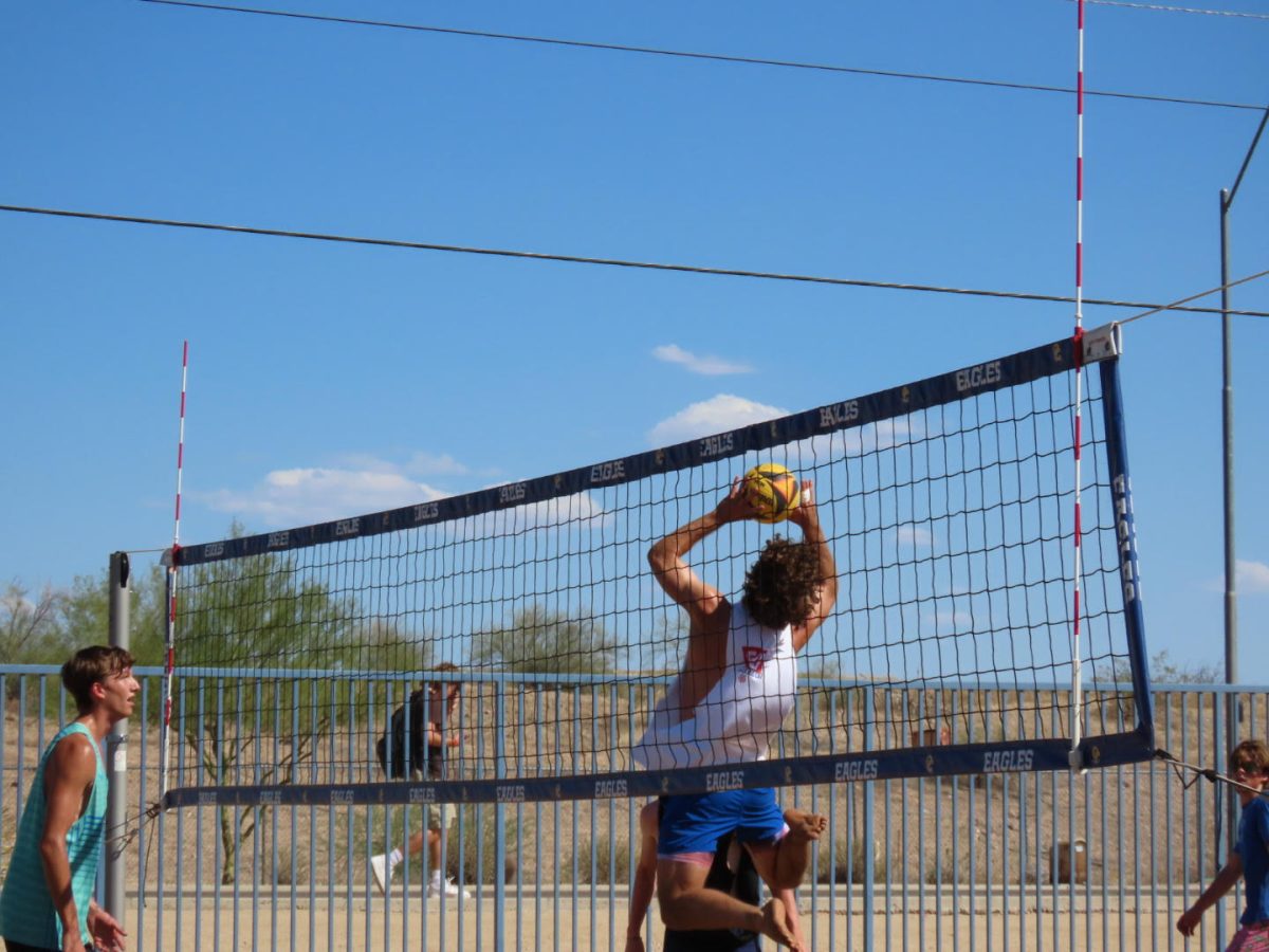 Cooper Wayne, senior, sets up the ball for his OHS teammate. 