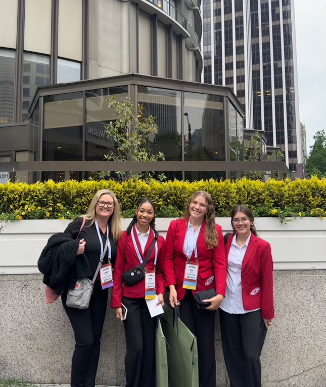 Lauren Tessmer, interior design teacher, Kailyn Carter, senior, Ava Sabyan, junior, and Jessie Estrella, junior, at FCCLA Nationals in Seattle, Washington.