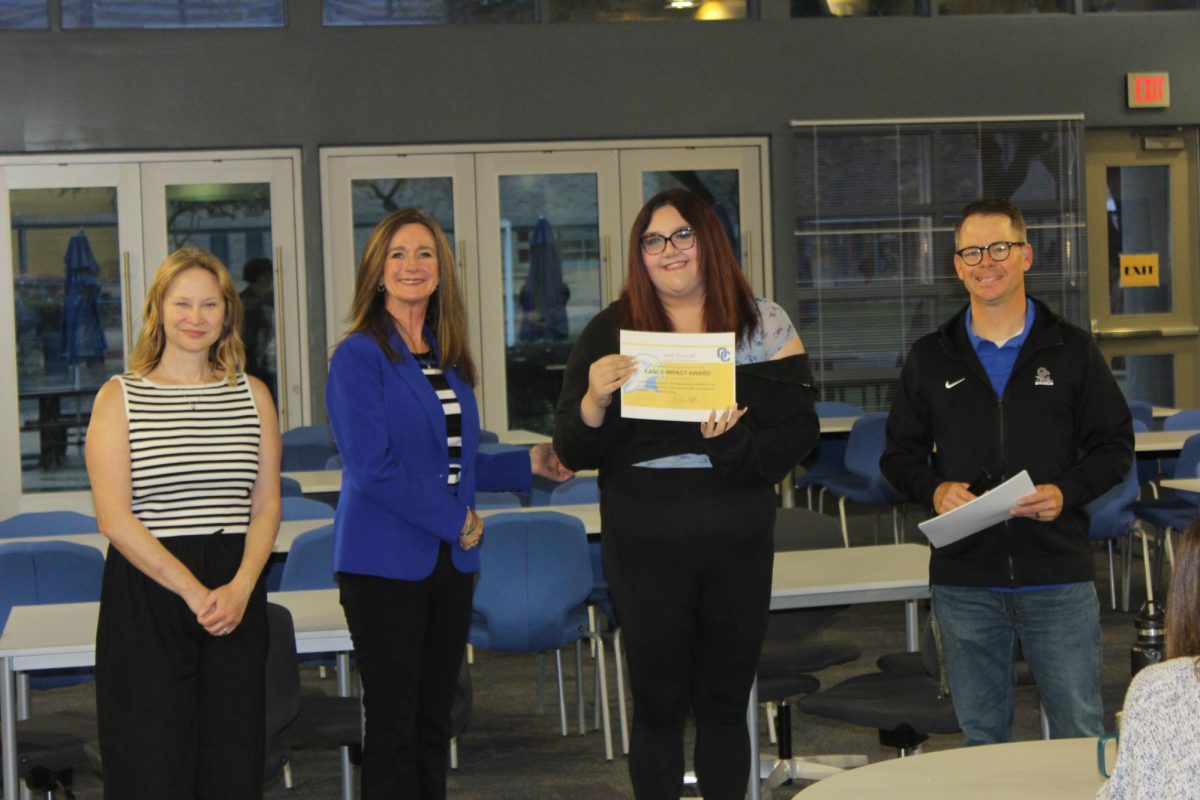  Leela Heitsmith standing with OHS admin and Vice Mayor Ann O’Brien for the Eagle Impact Award. (Left to right: Beth Baker, Ann O'Brien, Leela Heitsmith, and Justin McLain)