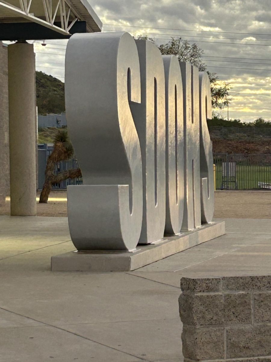 The school's sign reflecting the morning sun.