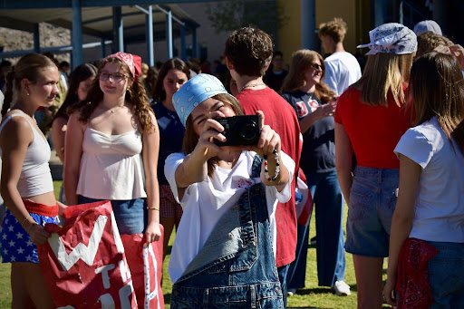 Sadie Clausen uses a digital camera at an Eagle Walk