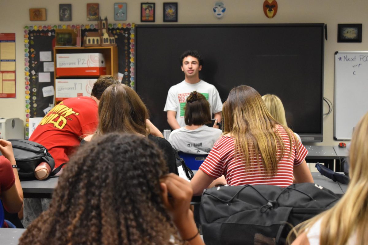 STUGO, led by student body president Preston Delly, has a group discussion while preparing for homecoming.
