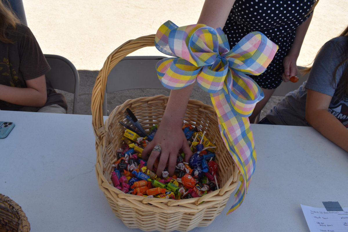 Children grab at Halloween candy in preparation for the popular fall holiday.