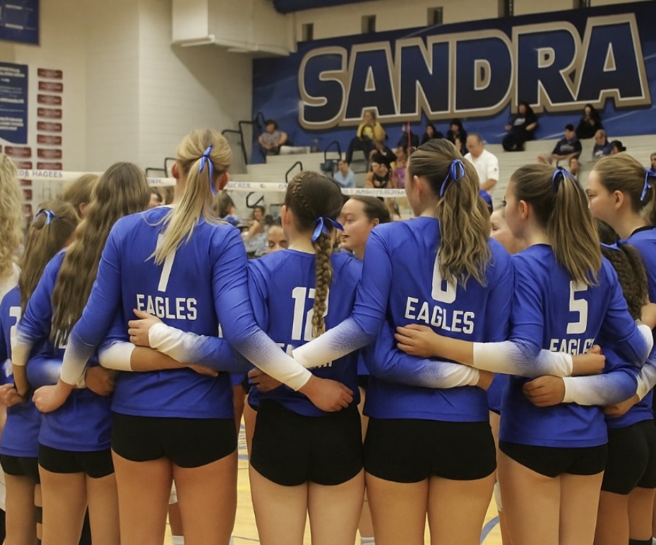 Varsity girls huddled together.