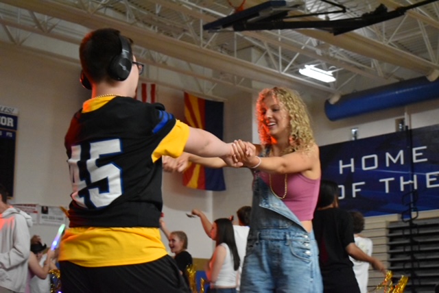 Scarlett Stanger, senior, and Porter Larson, freshman, dance at special education homecoming.
