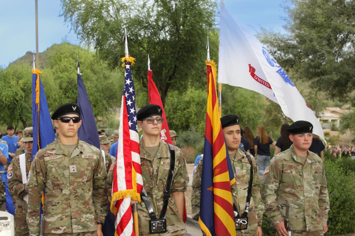 ROTC leads the crowd at the homecoming parade.