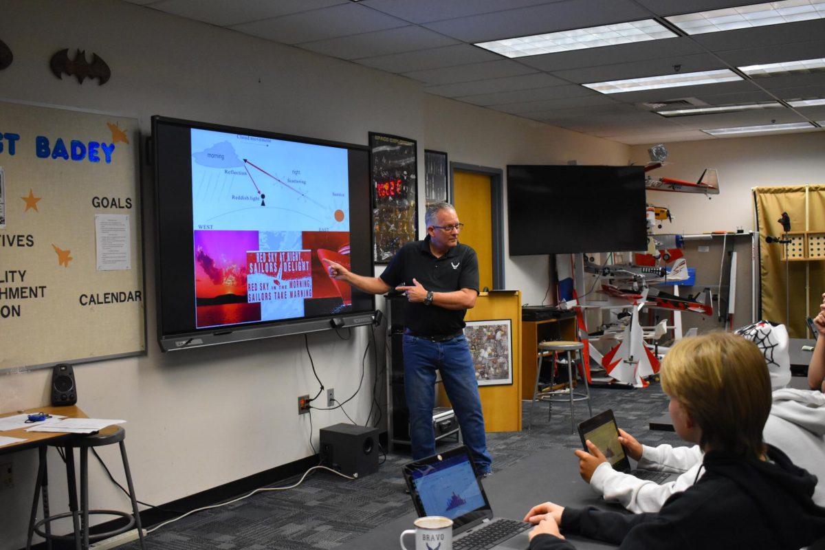 Major Whited teaches a class full of aspiring junior ROTC students.