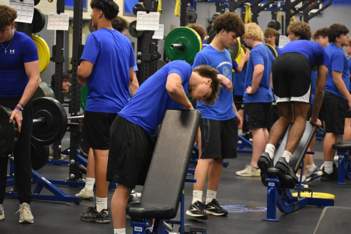 The OHS football team prepares for their upcoming season through power and weight training.