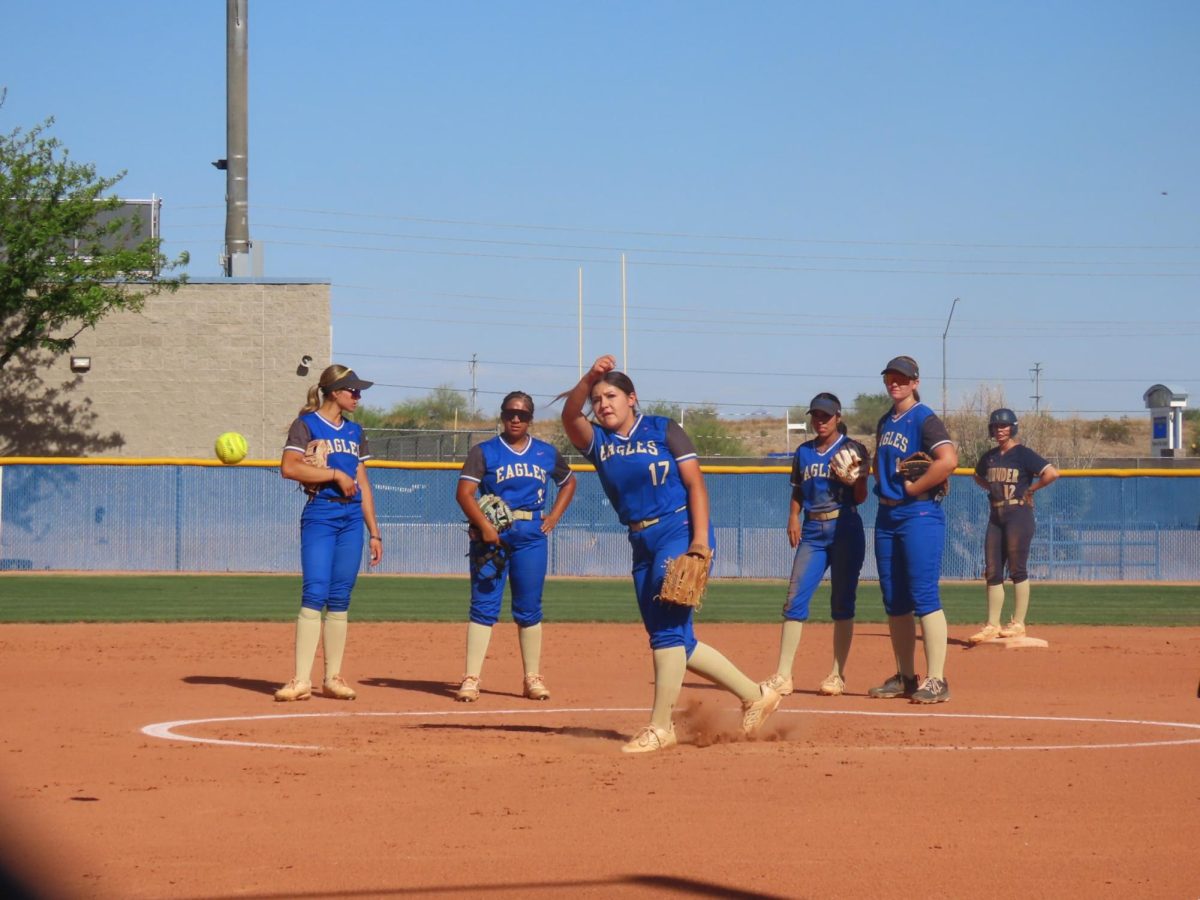 OHS softball girls circle the pitcher of the team to give her support.
