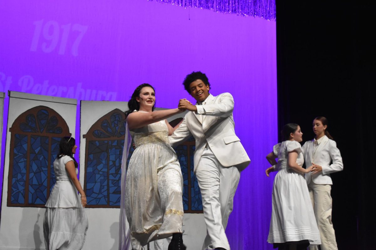 Anastasia, played by Madelene Salisbury, senior, dances with the Tsar, played by Isaiah Asmare, junior.