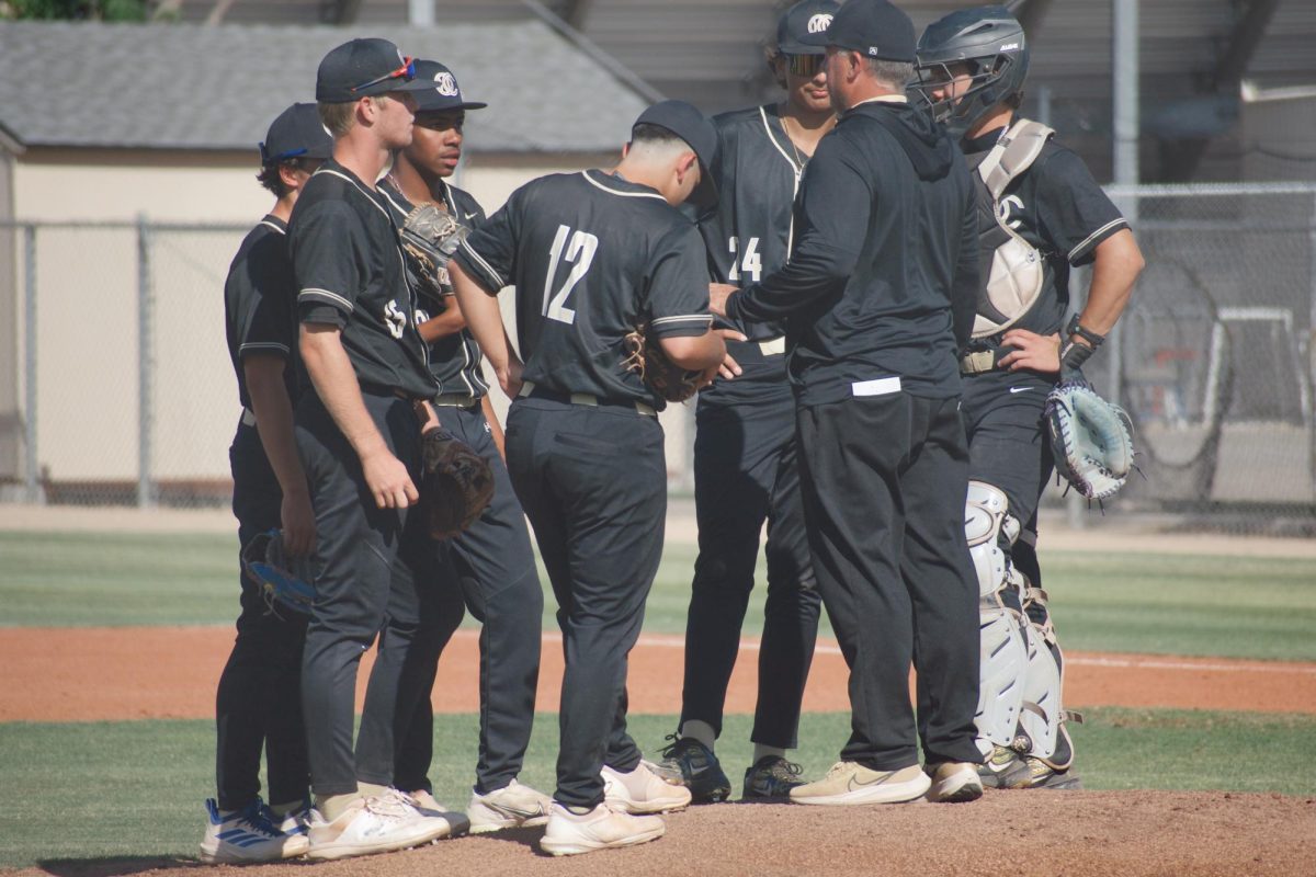 OHS varsity baseball meets during an intense playoff game to plan their next move.
