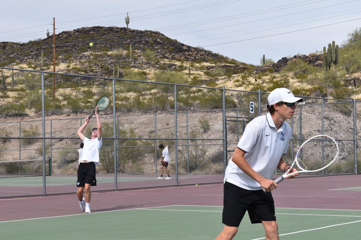 Michael Poortstra, senior, goes up for a serve.